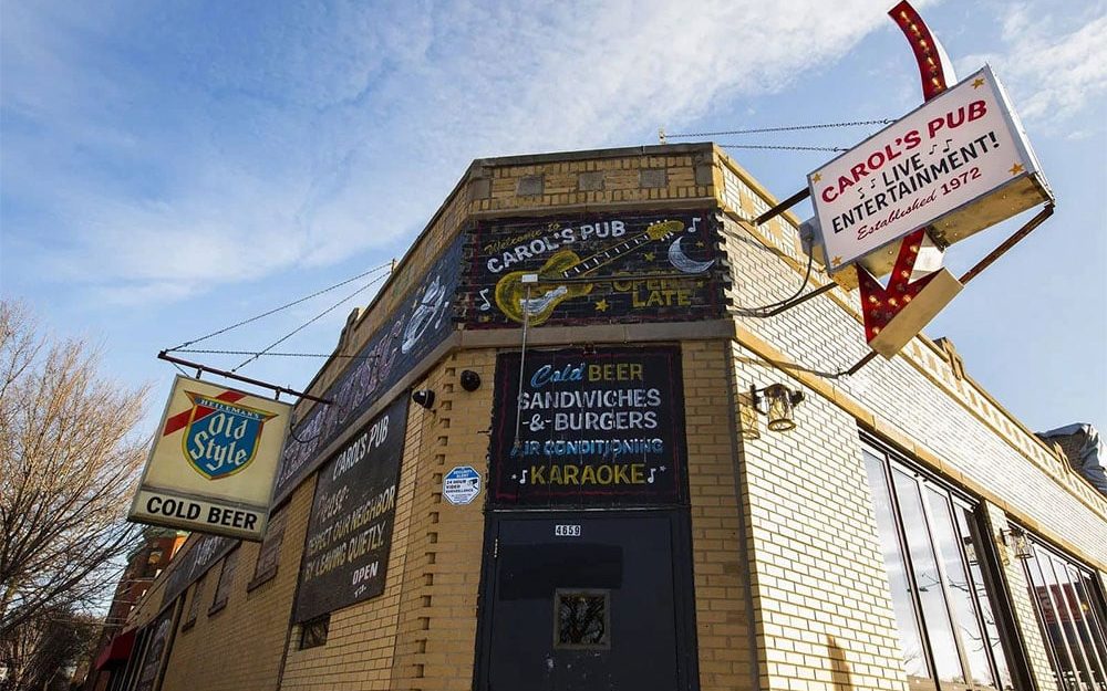 An exterior shot of Carol's Pub in Ravenswood, including its iconic red sign