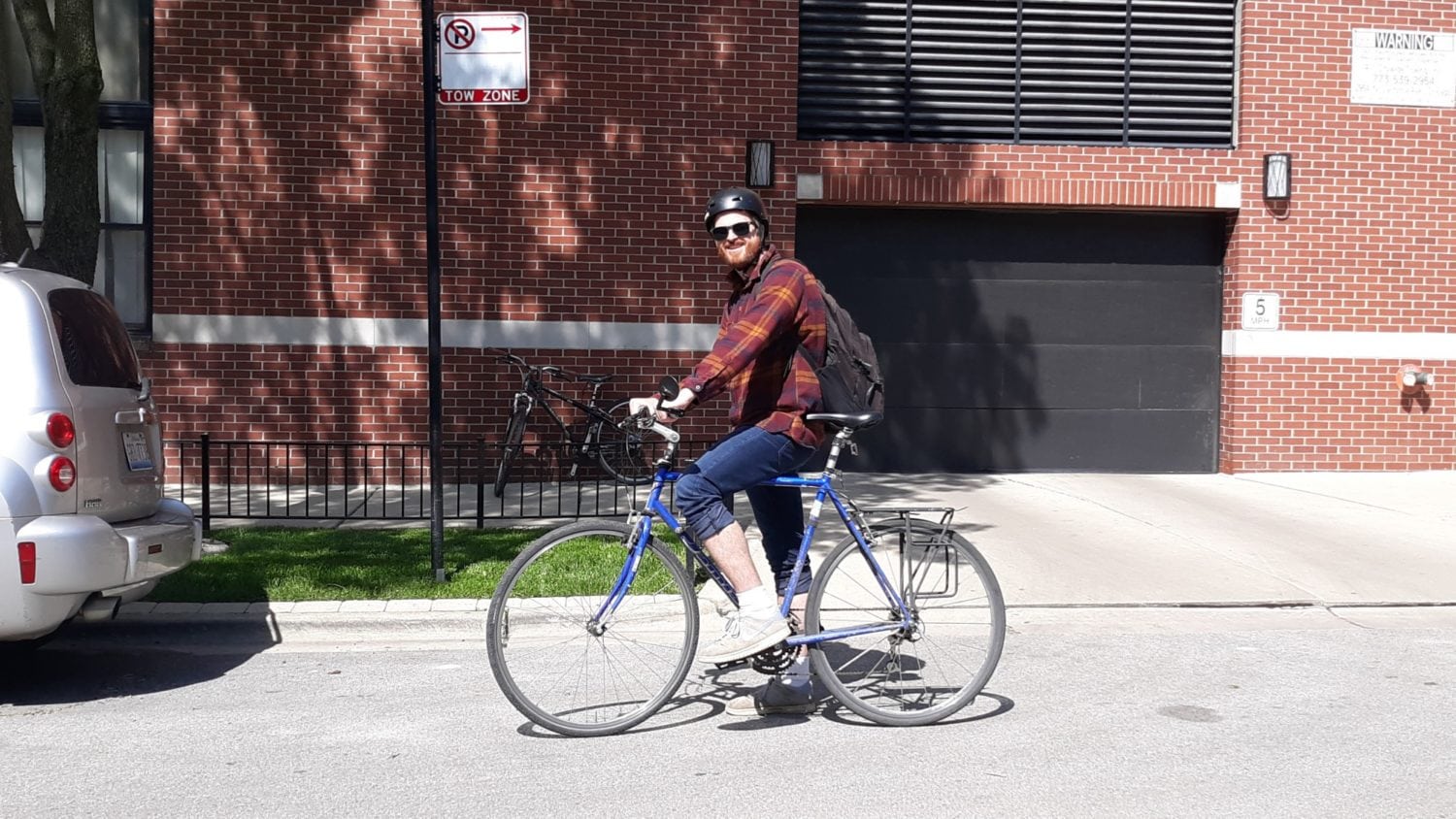 A flannel fellow on a bike in Ravenswood