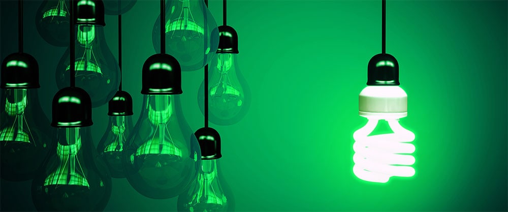 Industry and sustainability represented by green lightbulb