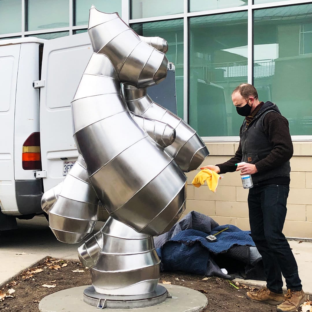 Installation of stainless steel sculpture in Ravenswood