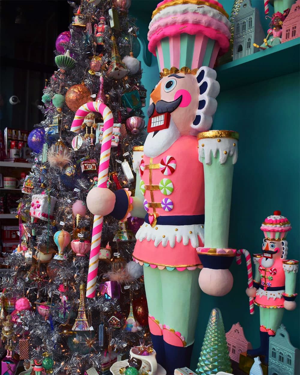 A picture of the holiday windows at Hazel, centered on Colonel Cupcake the nutcracker