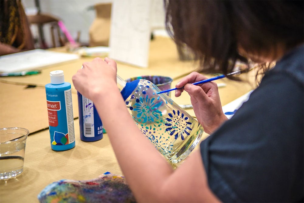 Halloween-themed bottle painting workshop at KOVAL Distillery in Ravenswood