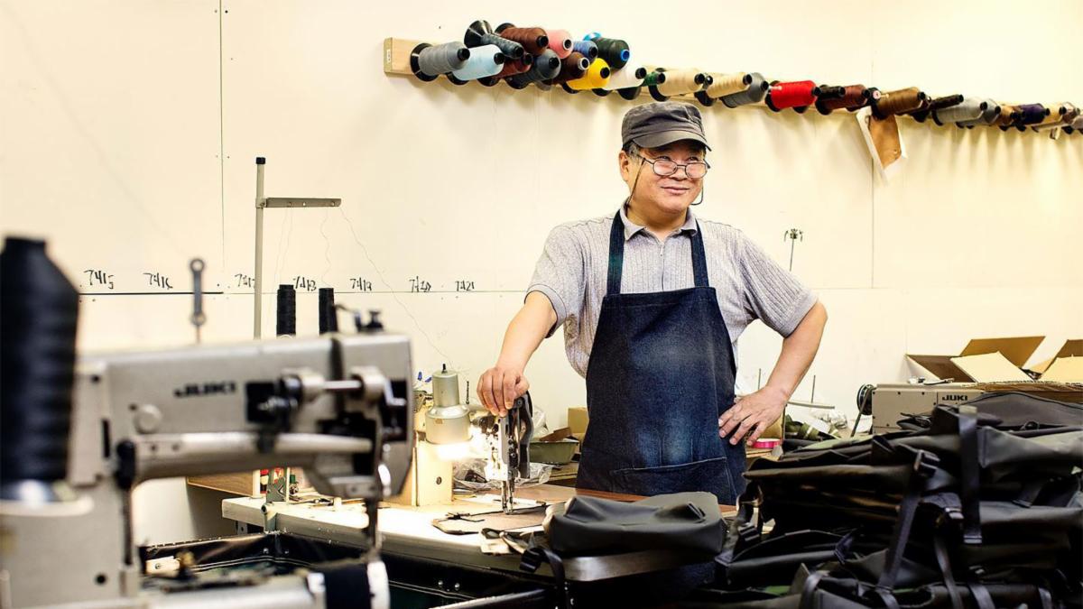 An employee at DEFY Mfg