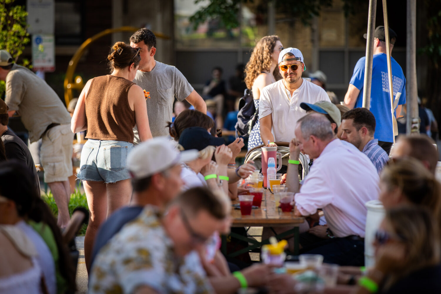 People eating and drinking while sitting at tables at Ravenswood On Tap