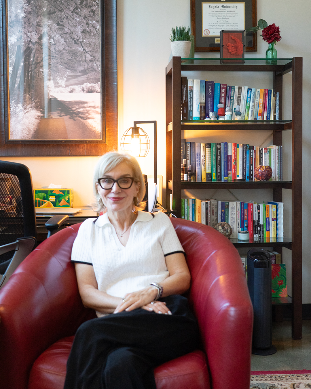 Dr. Katie Augustyn sits in her office