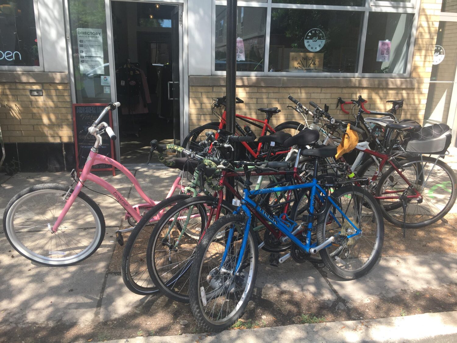 Bikes parked around a post