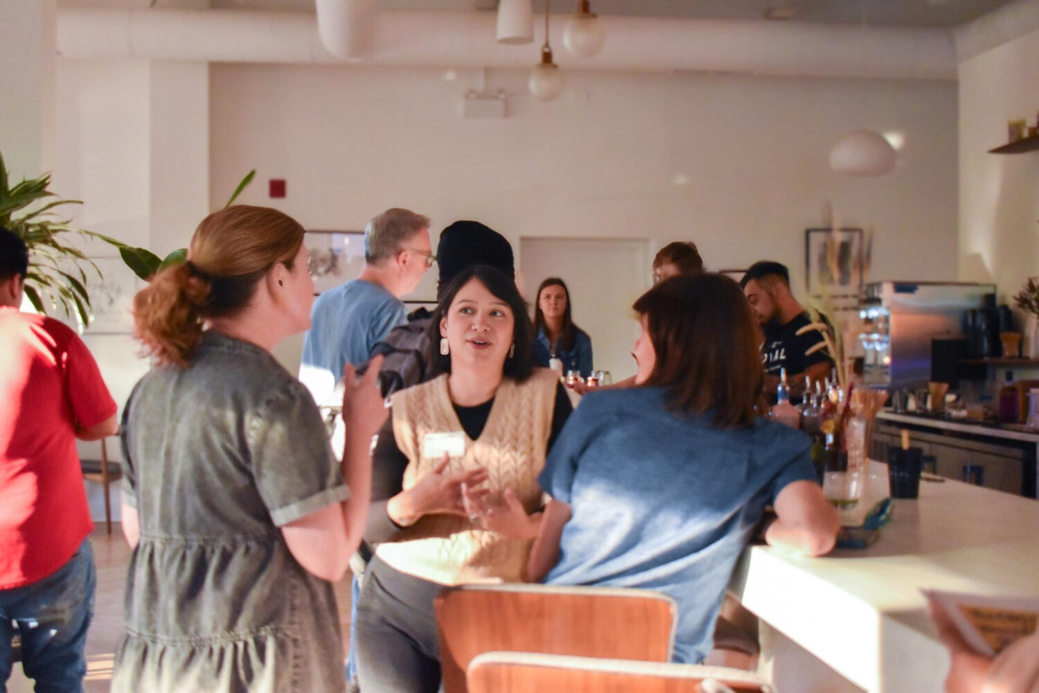 Jobseekers and employers mingle at a previous mixer event at KOVAL Distillery. 