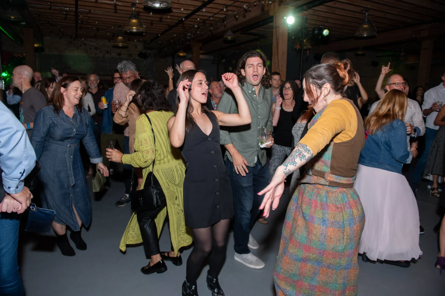 Attendees of Common Pantry's I Am Your Neighbor party get down on the dance floor 