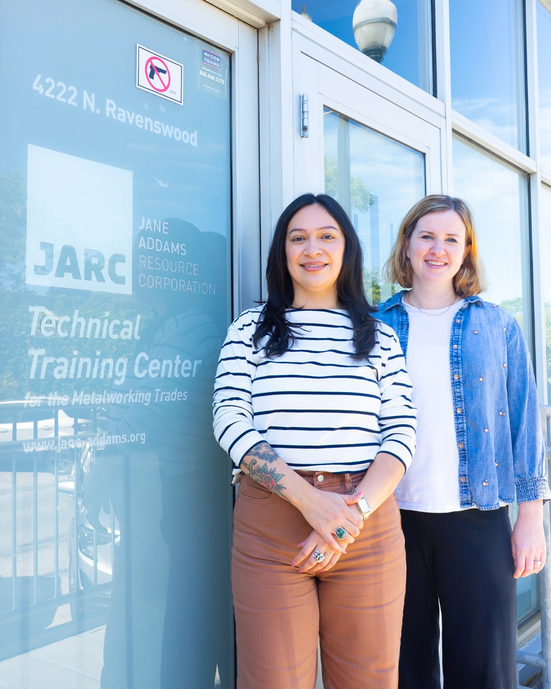 Mari and Emily pose outside of JARC